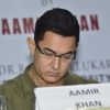 Aamir Khan goes through the Communicative Marathi Book at the Launch