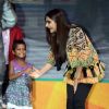 Sonam Kapoor greets a young fan at the Promotions of Khoobsurat in Delhi