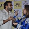 A guest feeds Raj Kundra a piece of cake at the Promotion of Iosis Medi Spa