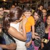 Priyanka Chopra plays with a kid at the Promotions of Mary Kom at Gold's Gym