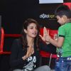 Priyanka Chopra teaches a young fan some boxing moves at the Promotions of Mary Kom