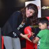 Priyanka Chopra gives an autographed boxing glove to a young fan at the Promotions of Mary Kom