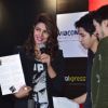 Priyanka Chopra recieves a hand made card by a fan at the Promotions of Mary Kom at Reliance Outlet