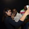 Priyanka Chopra clicks a selfie with her fans at the Promotions of Mary Kom at Reliance Outlet
