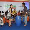 Purab Kohli and Tara Sharma playing the drum at Footsteps 4 Good Ngo Event