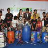 Purab Kohli and Tara Sharma playing the drum with kids at Footsteps 4 Good Ngo Event