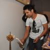 Randeep Hooda lights the lamp at the art show