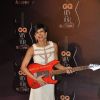 Mandira Bedi poses with a guitar at the GQ Men of the Year Awards