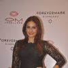 Huma Qureshi poses for the media at Om Jewelers Store