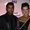Sachin Joshi poses with wife Urvashi Sharma at the Launch of Planet Hollywood