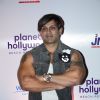 Yash Birla poses for the media at the Launch of Planet Hollywood