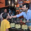 Vikas Khanna gives children some sweets at the Launch of Twist Of Taste - The Sweet Life