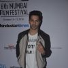Varun Dhawan poses for the media at the 16th MAMI Film Festival