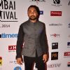 Rahul Bose poses for the media at the 16th MAMI Film Festival
