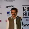 Rajkumar Hirani poses for the media at the 16th MAMI Film Festival