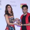 Vaani Kapoor presents an award to a winner at the Closing Ceremony of 16th MAMI Film Festival