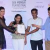 Parineeti Chopra presents an award to a winner at the Closing Ceremony of 16th MAMI Film Festival