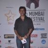 Rajat Kapoor poses for the media at the Closing Ceremony of 16th MAMI Film Festival
