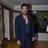 Ajay Devgn poses for the media on the Sets of KBC 8