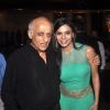 Mukesh Bhatt poses with a guest at the Launch of Rajneeti 2