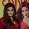 Raveena Tandon poses with the New Cover of Savvy at the Launch