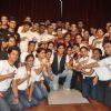 Shahrukh Khan poses with the staff at KidZania