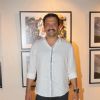 Atul Kasbekar poses for the media at Mongolia Day, An Art Exhibition by Shantanu Das