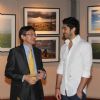 Mohit Marwah in conversation with a guest at Mongolia Day, An Art Exhibition by Shantanu Das