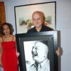 Anupam Kher poses with his potrait at the Inauguration of India Art Festival