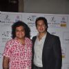 Dino Morea poses with Sahil Mane at 'Why A Stray' Calendar Launch