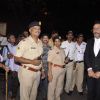 Jackie Shroff poses with Police Officials at Camel Colors Exhibition