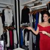Elli Avram points out at the designs at the bebe Store