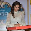 Sonam Kapoor autographs the DVD of Khoobsurat at the launch