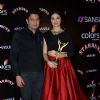 Bhushan Kumar poses with wife Divya Kumar at the Sansui Stardust Awards Red Carpet