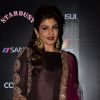 Raveena Tandon poses for the media at Sansui Stardust Awards Red Carpet