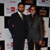 Abhishek Bachchan and Amitabh Bachchan pose for the media at Big Star Entertainment Awards 2014