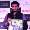 Arjun Kapoor poses with the Latest Issue of Filmfare Magazine at the Launch