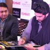 Arjun Kapoor signs his autograph on the Latest Issue of Filmfare Magazine