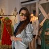 Amrita Arora poses for the media at Seema Khan's Christmas Collection Launch