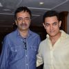Aamir Khan and Rajkumar Hirani pose for the media at P.K. Contest Winners Meet