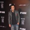Varun Sharma poses for the media at FHM Bachelor of the Year Bash