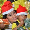 Shriya Saran poses with a kid during Christmas Celebration with Access Life NGO