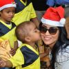 A small kid gives Shriya Saran a kiss at the Christmas Celebration
