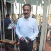 Baba Siddique poses for the media at Joe Rajan's Christmas Bash