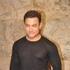 Aamir Khan poses for the media at the Special Screening of P.K. for Sanjay Dutt