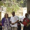 Manoj Jain and Reema Kapoor pose for the media at the Get-to-Gather for a Christmas Lunch