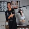 Jacqueline Fernandes poses with her photo at Dabboo Ratnani's Calendar Launch