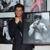 Shah Rukh Khan poses with his photo at Dabboo Ratnani's Calendar Launch