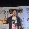 Varun Dhawan poses with his award at Lion Gold Awards