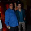 Varun Dhawan poses with father David Dhawan at the Song Launch of Badlapur